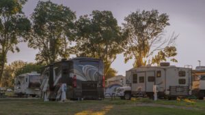 A beautiful sunrise at a rv resort with motor homes and tent camping